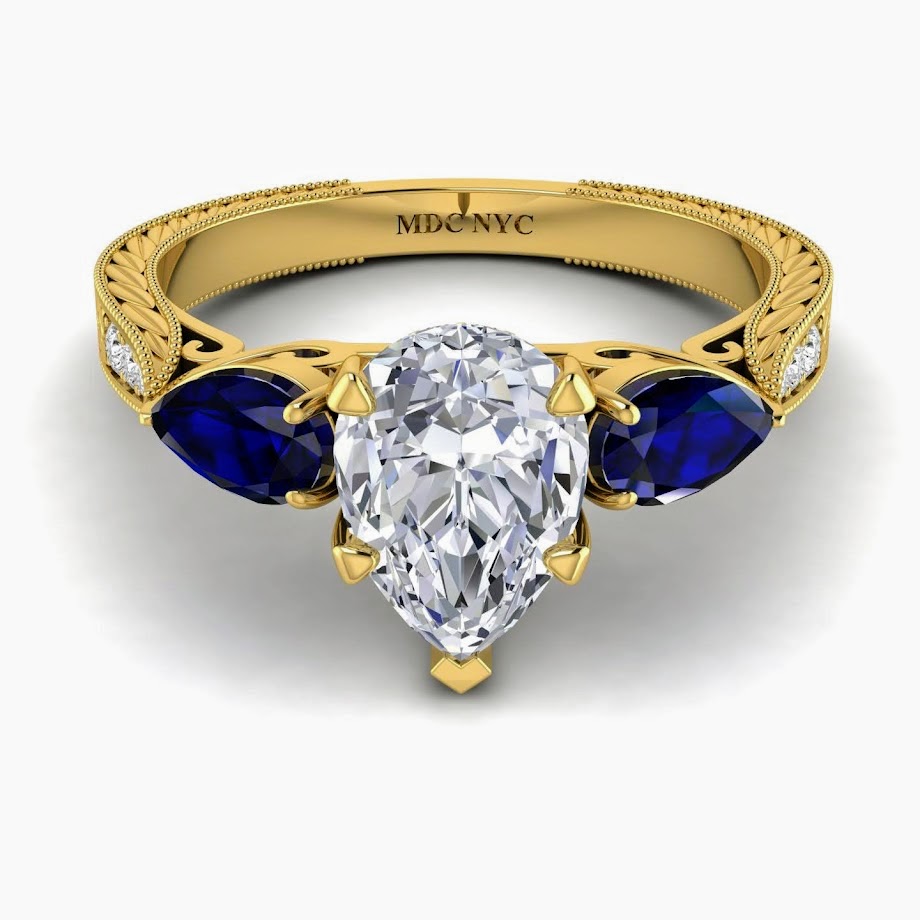 Pear Shape Diamond Engagement Ring Blue Sapphire Pear side stones Hand Engraved Yellow Gold band